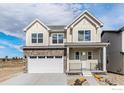 Charming two-story home with stone accents, a two-car garage, and a landscaped front yard at 399 Blackfoot St, Superior, CO 80027