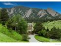 Elegant home with mountain views and a long driveway at 45 Bellevue Dr, Boulder, CO 80302