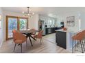 Modern kitchen with stainless steel appliances and an island at 12802 E Nevada Cir, Aurora, CO 80012