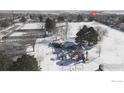 Aerial view of park with playground and pavilion in winter at 1605 Longbow Ct, Lafayette, CO 80026