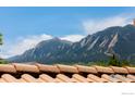 Stunning mountain views from a home's roofline at 1715 Sunset Blvd, Boulder, CO 80304