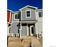 Gray townhome with back entry and small patio area at 2150 Violet Ave, Boulder, CO 80304