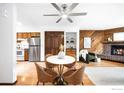 Bright dining area with a round table and four leather chairs, located near the kitchen at 2725 Juniper Ave # 78, Boulder, CO 80304