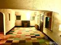 Entryway with colorful tiled floor and wood accents at 3139 Benton St, Wheat Ridge, CO 80214