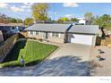 House with a spacious lawn, driveway, and attached garage at 3146 W 134Th Ct, Broomfield, CO 80020