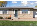 Brick front of a ranch home with a landscaped yard at 3146 W 134Th Ct, Broomfield, CO 80020