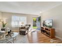 Bright living room featuring hardwood floors and comfy seating at 3146 W 134Th Ct, Broomfield, CO 80020