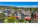 Modern home with red accents, aerial view of neighborhood at 3255 Ouray St, Boulder, CO 80301