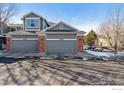 Two-story home with gray siding and a two-car garage at 3537 W 125Th Cir, Broomfield, CO 80020