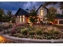 Modern farmhouse exterior with landscaping at dusk at 3621 21St St, Boulder, CO 80304