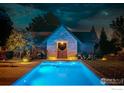 Night view of a backyard pool and pool house at 3621 21St St, Boulder, CO 80304