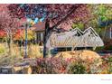 Community entrance sign for Candlelight Ridge surrounded by mature trees and landscaping at 449 Meadow View Pkwy, Erie, CO 80516