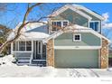 Two-story house with stone and siding exterior, snowy front yard, and attached garage at 4856 10Th St, Boulder, CO 80304