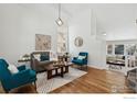 Bright living room with hardwood floors, comfy seating, and large windows at 4856 10Th St, Boulder, CO 80304