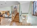 Elegant wooden staircase leading to upper level at 5526 Friends Pl, Boulder, CO 80303