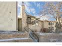 Condo exterior with private balcony and stone accents at 7880 W 87Th Dr # C, Arvada, CO 80005