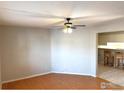 Simple living room with light walls, wood floors, and ceiling fan at 8266 Washington St # 82, Denver, CO 80229