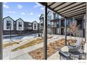 Townhome community with covered patios and walkways at 12387 W 51St Ave, Wheat Ridge, CO 80033