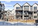 Two story townhome with modern exterior finishes at 12387 W 51St Ave, Wheat Ridge, CO 80033