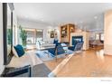 Open concept living area with a fireplace and built-in shelving at 1531 Dellwood Ave, Boulder, CO 80304