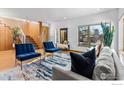 Bright and airy living room featuring a comfortable seating area and hardwood floors at 1531 Dellwood Ave, Boulder, CO 80304