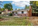 Ranch style home with brick exterior and landscaping at 1855 Grape Ave, Boulder, CO 80304