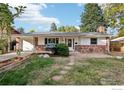 Brick ranch home with updated landscaping and walkway at 1855 Grape Ave, Boulder, CO 80304