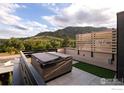 Relaxing hot tub on rooftop patio with mountain views and privacy screen at 1955 3Rd St # 6, Boulder, CO 80302