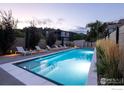 Inviting lap pool with surrounding lounge chairs and landscaping at 1955 3Rd St # 6, Boulder, CO 80302