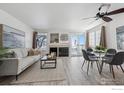 Spacious living room with fireplace and light grey couch at 2141 Sunridge Cir, Broomfield, CO 80020