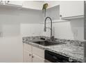 Kitchen sink with modern faucet and granite countertop at 2707 Valmont Rd # 307D, Boulder, CO 80304