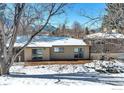 Deck and snowy backyard with mountain views at 350 Hopi Pl, Boulder, CO 80303