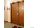 Apartment entry door with wood door and rug at 624 Pearl St # 404, Boulder, CO 80302