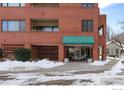 Building entrance with awning and snow on the ground at 624 Pearl St # 404, Boulder, CO 80302