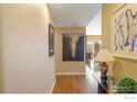 Hallway with hardwood floors and artwork at 624 Pearl St # 404, Boulder, CO 80302