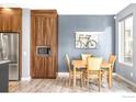 Kitchen dining area with light wood table and chairs at 11278 Colony Cir, Broomfield, CO 80021