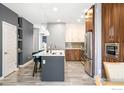 Modern kitchen with stainless steel appliances and island at 11278 Colony Cir, Broomfield, CO 80021