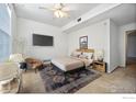 Virtually staged bedroom with a large bed and seating at 3000 Blue Sky Cir # 108, Erie, CO 80516