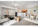 Virtually staged living room with open floor plan at 3000 Blue Sky Cir # 108, Erie, CO 80516