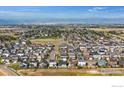 Aerial view showcasing the home's location in a well-established neighborhood with mountain views at 6508 Copper Dr, Frederick, CO 80516