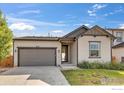 Attractive exterior features a two-car garage and well-manicured landscaping at 6508 Copper Dr, Frederick, CO 80516