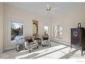 Bright sitting room with two armchairs and large windows at 7172 Waterford Ct, Niwot, CO 80503