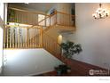 Two-story home with hardwood floors and a wooden staircase at 12609 Jersey W Cir, Thornton, CO 80602