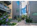 Pathway through a private courtyard with green plants at 1655 Walnut St # 309, Boulder, CO 80302