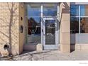 Building entryway with glass doors and brick facade at 1655 Walnut St # 309, Boulder, CO 80302