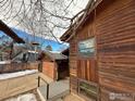 House exterior with wooden siding, garage, and driveway at 1743 Hawthorn Pl, Boulder, CO 80304