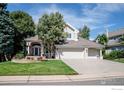 Exterior view of two story house with attached three car garage at 1825 Vernon Ln, Superior, CO 80027