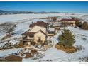 Aerial view of a home with mountain views and barn at 420 E County Road 10, Berthoud, CO 80513