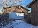 Detached brick garage with a unique design element above the door at 4580 Garland St, Wheat Ridge, CO 80033