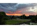 Stunning sunset view of the neighborhood with mountains in the background at 7181 Longview Dr, Niwot, CO 80503